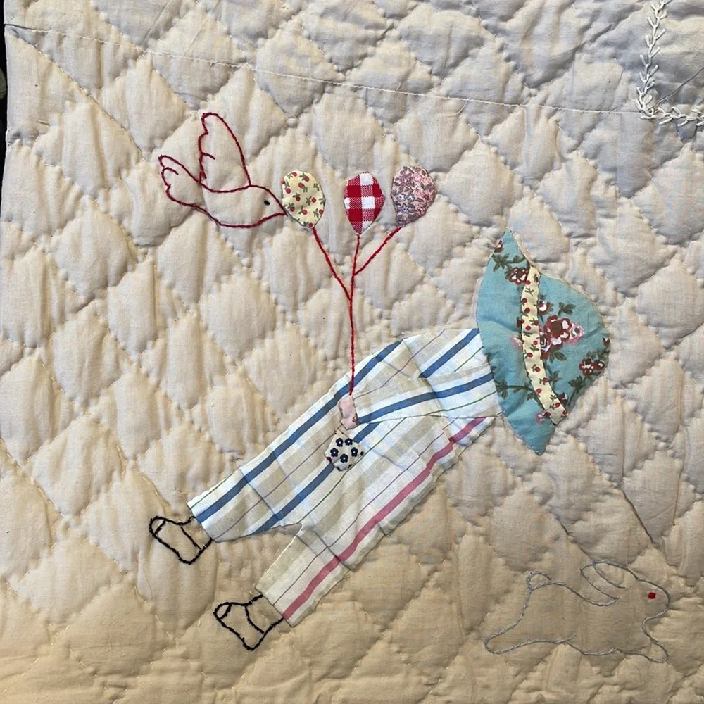 Appliqued and embroidered quilt